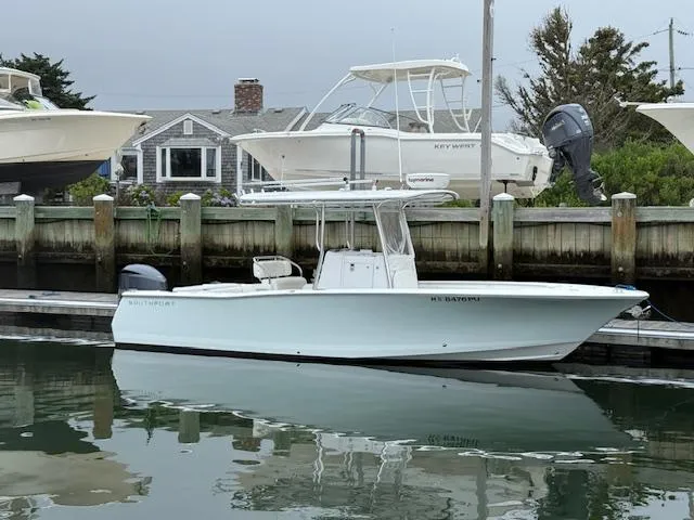 Slide: The Image of 2008 Southport 26 Center Console boat docked in a marina. - 1