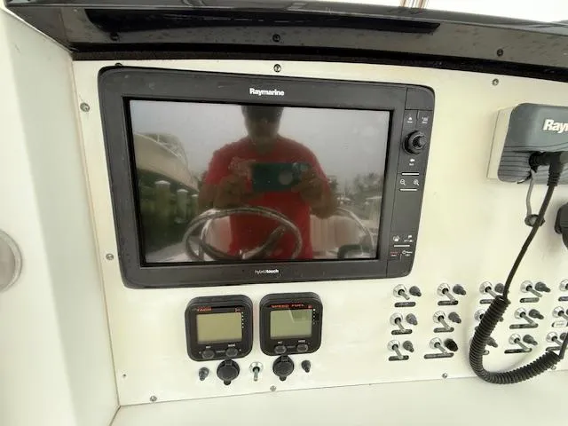 Slide: The Image of Console of 2008 Southport 26 Center Console with Raymarine navigation system and controls. - 16