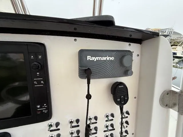 Slide: The Image of Control panel of 2008 Southport 26 Center Console with Raymarine equipment. - 18