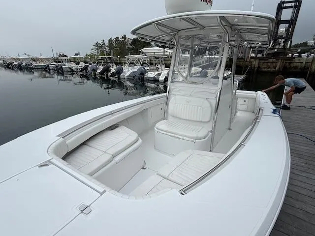 Slide: The Image of 2008 Southport 26 Center Console boat docked, featuring spacious seating and sleek design. - 3