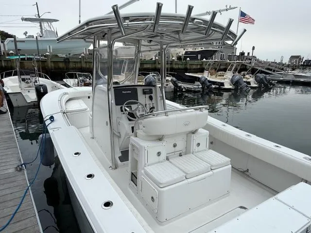 Slide: The Image of 2008 Southport 26 Center Console boat docked in a marina. - 5