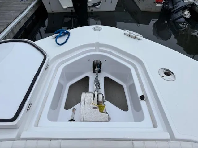 Slide: The Image of 2008 Southport 26 Center Console anchor compartment with chain and cleat. - 6