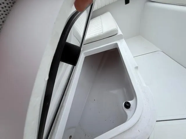 Slide: The Image of Open storage compartment on 2008 Southport 26 Center Console boat. - 8