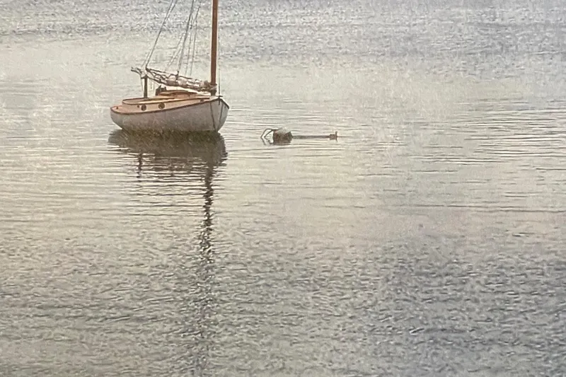 The Image of Vintage 1978 Marshall Sanderling sailboat anchored on calm water. - 1