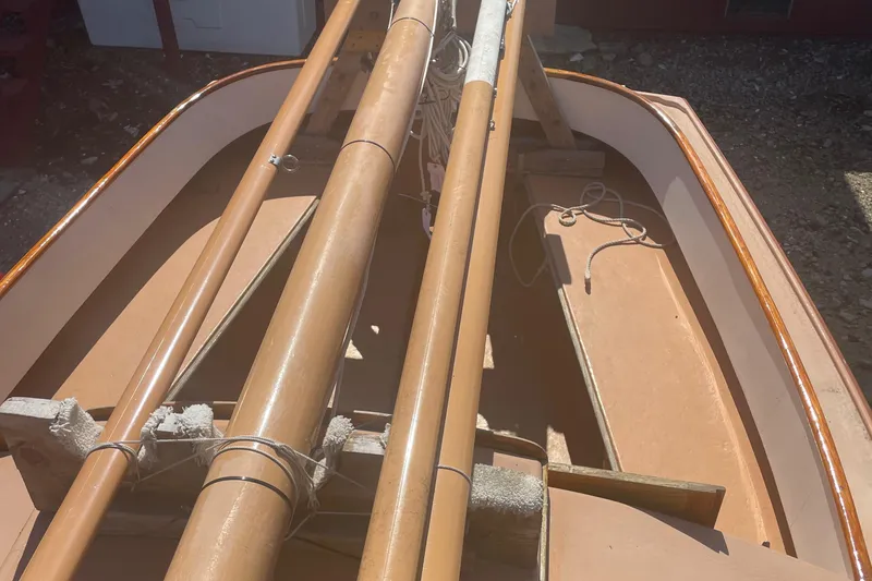 Slide: The Image of 1978 Marshall Sanderling sailboat interior with wooden masts and ropes. - 7