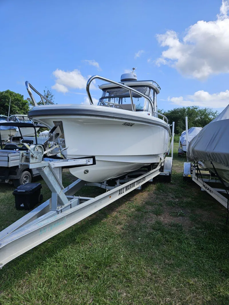 The Image of 2023 Nimbus Tender 8 boat on trailer under blue sky. - 0
