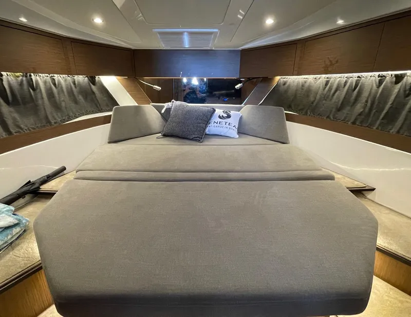 Slide: The Image of Luxurious interior cabin of 2023 Beneteau Antares 11 OB with cozy bedding. - 11