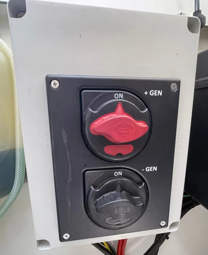 Slide: The Image of Control panel on 2023 Beneteau Antares 11 OB with generator switches. - 18