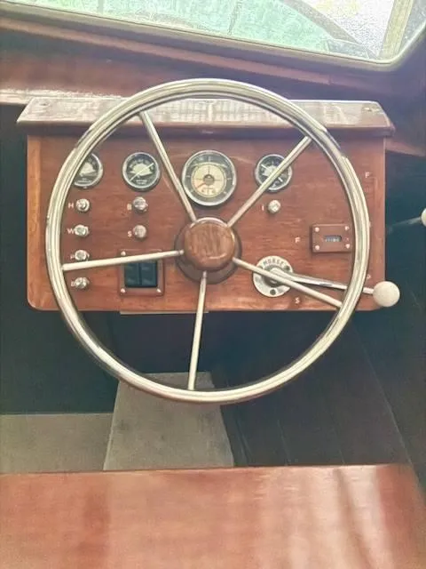 Slide: The Image of 1968 Lyman 19 boat dashboard with vintage steering wheel and gauges. - 11