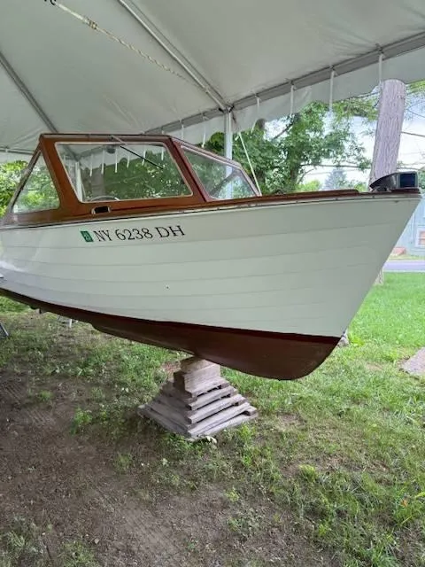 Slide: The Image of 1968 Lyman 19 boat under a tent, displaying registration number NY 6238 DH. - 2