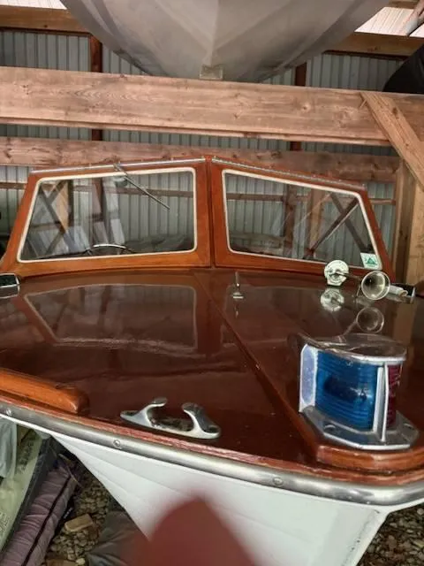 Slide: The Image of 1968 Lyman 19 boat with wooden deck and windshield in storage. - 6