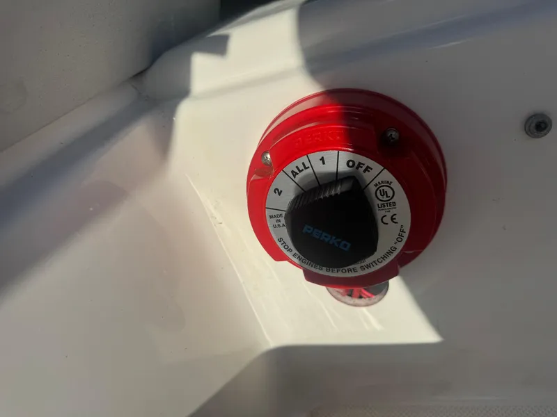 Slide: The Image of Battery switch on 2017 Hurricane SunDeck Sport 201 OB boat, featuring Perko marine equipment. - 10