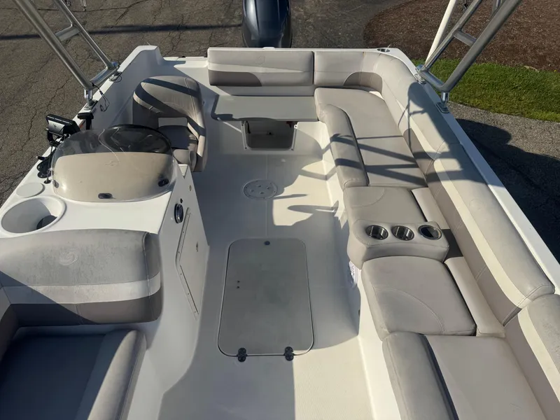 Slide: The Image of 2017 Hurricane SunDeck Sport 201 OB boat interior with spacious seating and cup holders. - 4