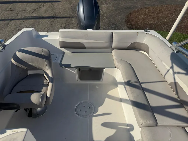 Slide: The Image of 2017 Hurricane SunDeck Sport 201 OB boat interior with seating and table. - 6