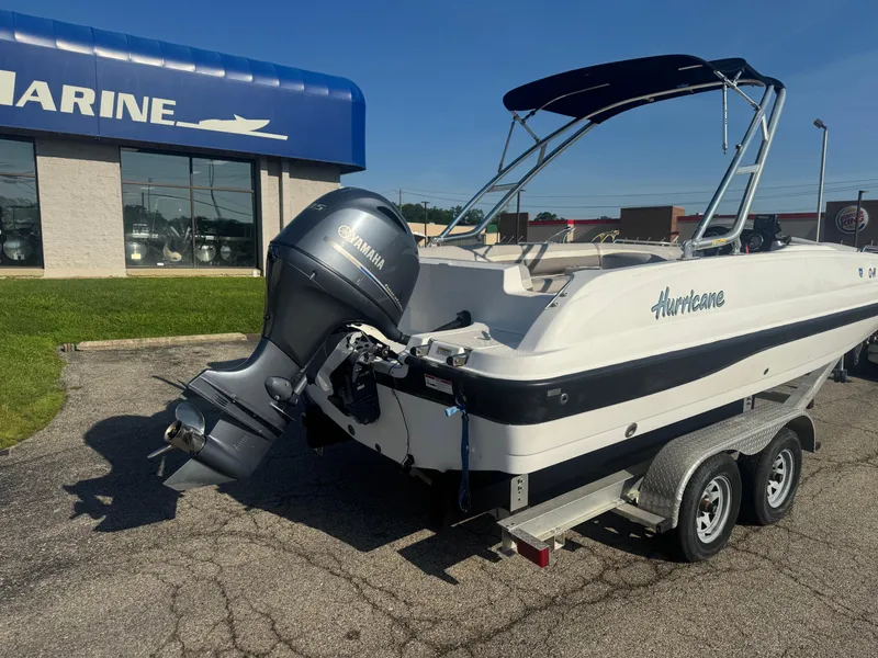 Slide: The Image of 2017 Hurricane SunDeck Sport 201 OB boat with Yamaha outboard motor on trailer. - 8