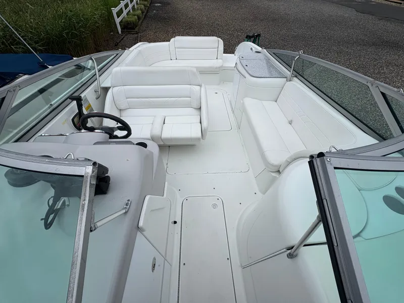 Slide: The Image of 2004 Formula 260 Bowrider with white seating and spacious deck layout. - 13