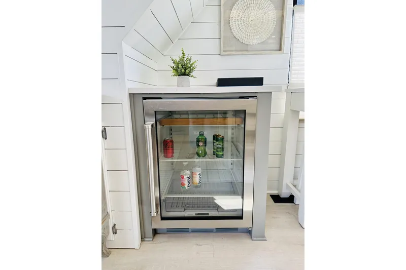 Slide: The Image of Modern kitchen with open pull-out pantry shelves in a 1992 Sumerset 66 houseboat. - 10