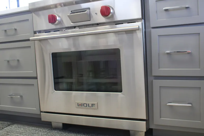 Slide: The Image of Modern kitchen in 1992 Sumerset 66 houseboat with stainless steel appliances and sleek cabinetry. - 12