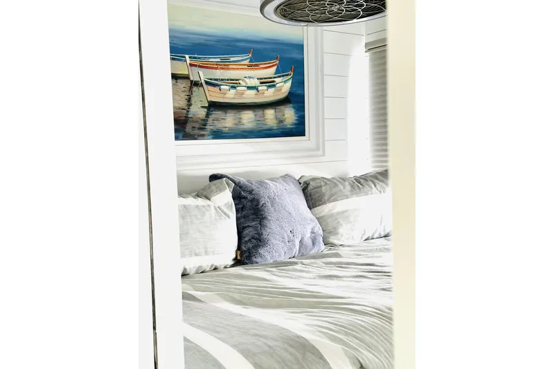 Slide: The Image of Laundry area with stacked washer and dryer in a 1992 Sumerset 66 houseboat. - 18