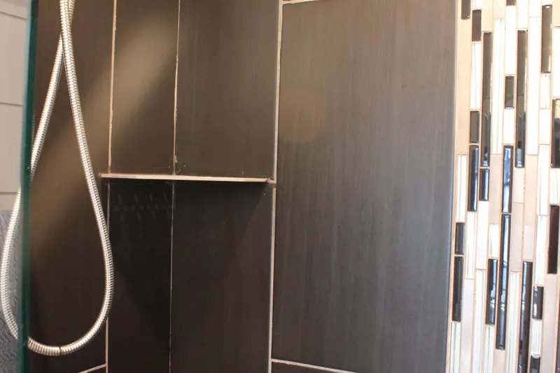 Slide: The Image of Cozy bedroom in 1992 Sumerset 66 houseboat with striped bedding and nautical artwork. - 23