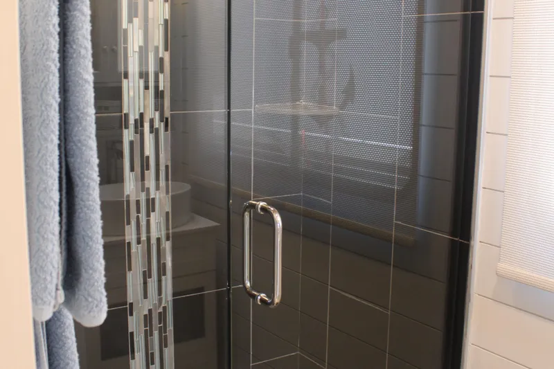 Slide: The Image of Bathroom interior of 1992 Sumerset 66 houseboat with modern fixtures and storage baskets. - 24