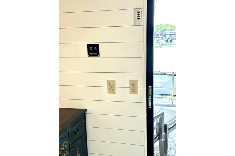 Slide: The Image of Cozy bedroom interior in 1992 Sumerset 66 houseboat with modern decor and nautical theme. - 31