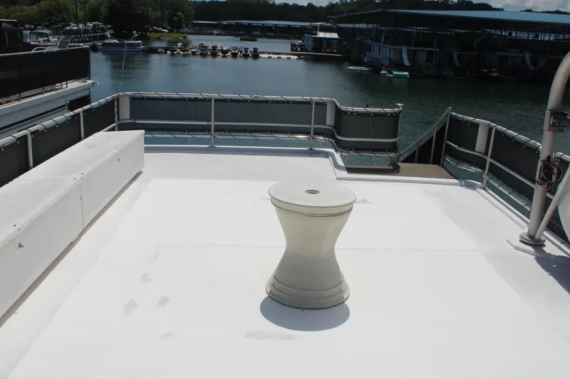 Slide: The Image of 1992 Sumerset 66 houseboat deck with patterned carpet and lake view. - 41