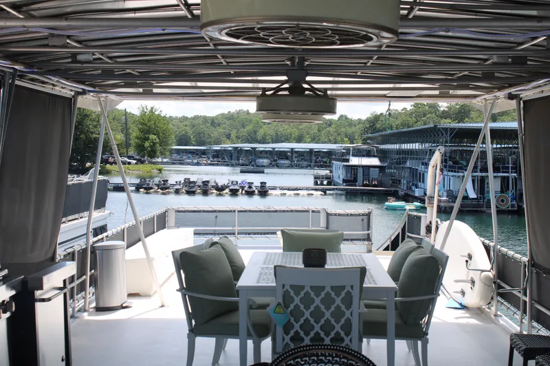 Slide: The Image of Rooftop deck of 1992 Sumerset 66 houseboat with seating and table, overlooking marina. - 44
