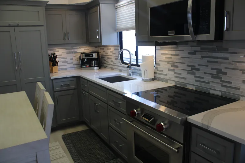 Slide: The Image of 1992 Sumerset 66 houseboat with glass doors, outdoor seating, and lake view. - 58