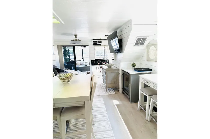 Slide: The Image of Interior of 1992 Sumerset 66 houseboat with modern kitchen and cozy living area. - 6
