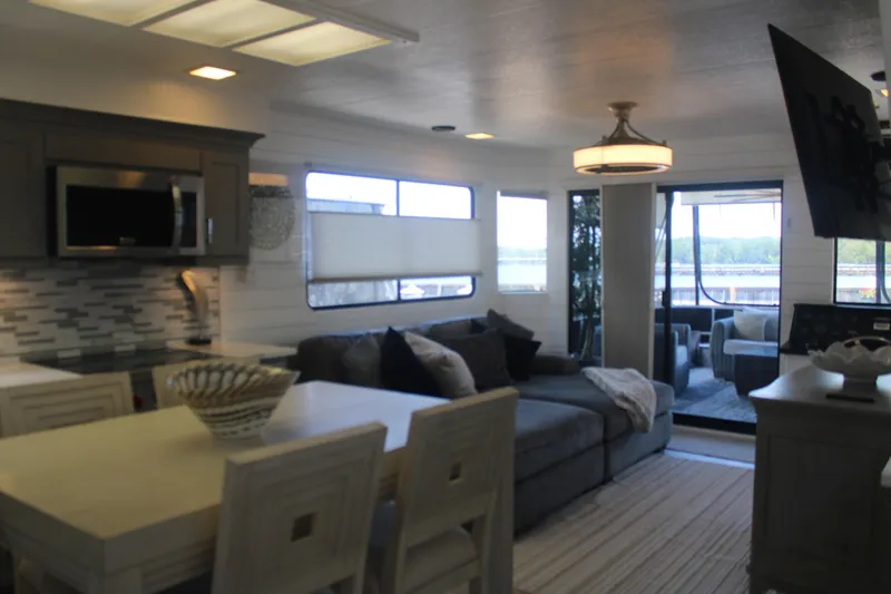 Slide: The Image of Modern kitchen interior in a 1992 Sumerset 66 houseboat, featuring sleek appliances and stylish cabinetry. - 60