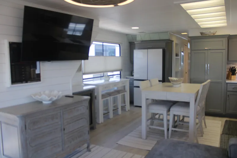 Slide: The Image of Modern kitchen in a 1992 Sumerset 66 houseboat with gray cabinets and stainless steel appliances. - 61