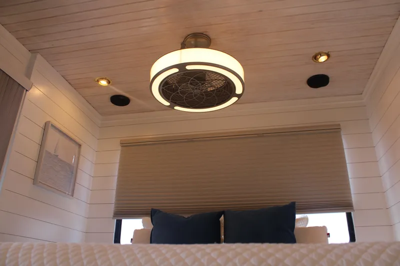 Slide: The Image of Interior of 1992 Sumerset 66 houseboat with modern ceiling fan and cozy decor. - 66