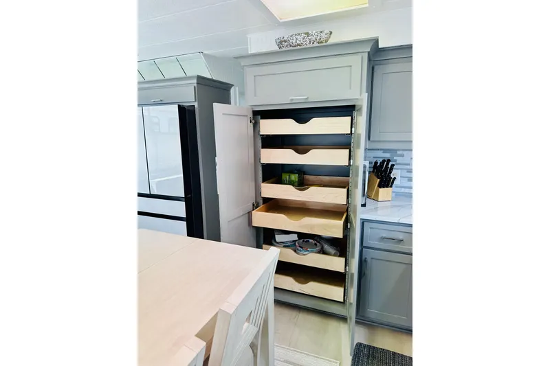 Slide: The Image of Interior of a 1992 Sumerset 66 houseboat with modern furnishings and a cozy living area. - 7