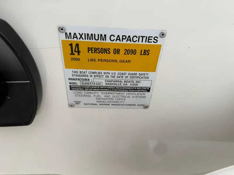 Slide: The Image of Capacity label on 1999 Chaparral Sunesta 232 boat, max 14 persons or 2090 lbs. - 12
