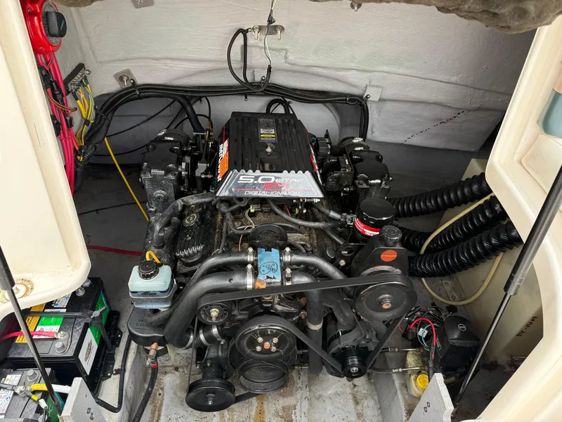 Slide: The Image of 1999 Chaparral Sunesta 232 engine compartment with 5.0L V8 motor and wiring. - 13