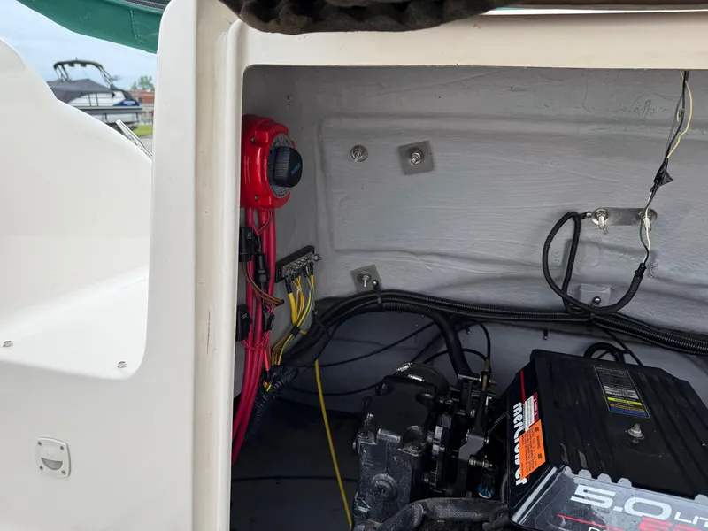 Slide: The Image of 1999 Chaparral Sunesta 232 engine compartment with wiring and battery switch visible. - 15