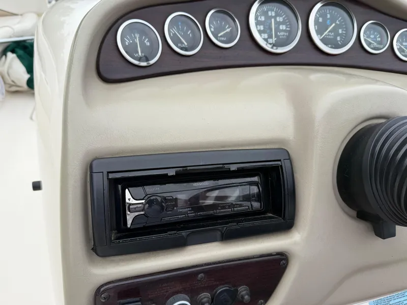 Slide: The Image of Dashboard of a 1999 Chaparral Sunesta 232 boat with gauges and stereo system. - 20