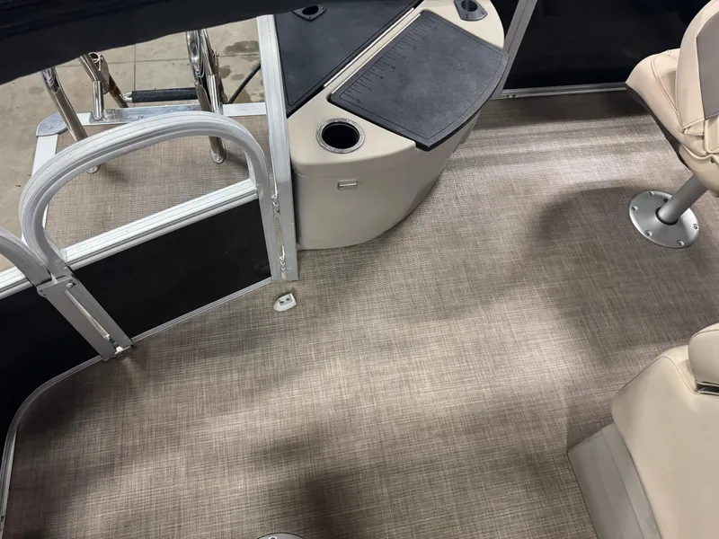 Slide: The Image of 2023 Sun Tracker SportFish 20 DLX interior with seating and flooring details. - 16
