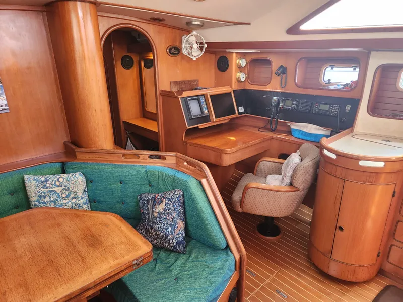 Slide: The Image of Interior of 1989 Taswell 43 yacht with wooden furnishings and navigation station. - 27