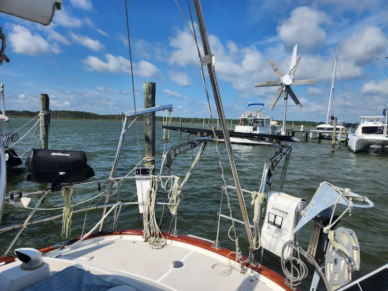 Slide: The Image of Sailboat deck view, Taswell 43, 1989 model, docked with clear skies and water. - 7