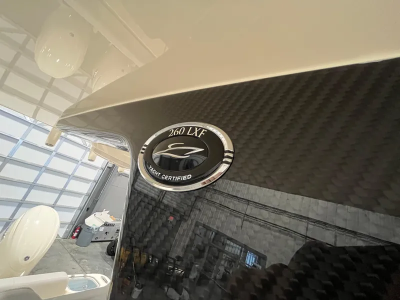 Slide: The Image of 2026 Scout 260 LXF yacht certification emblem on carbon fiber finish. - 21