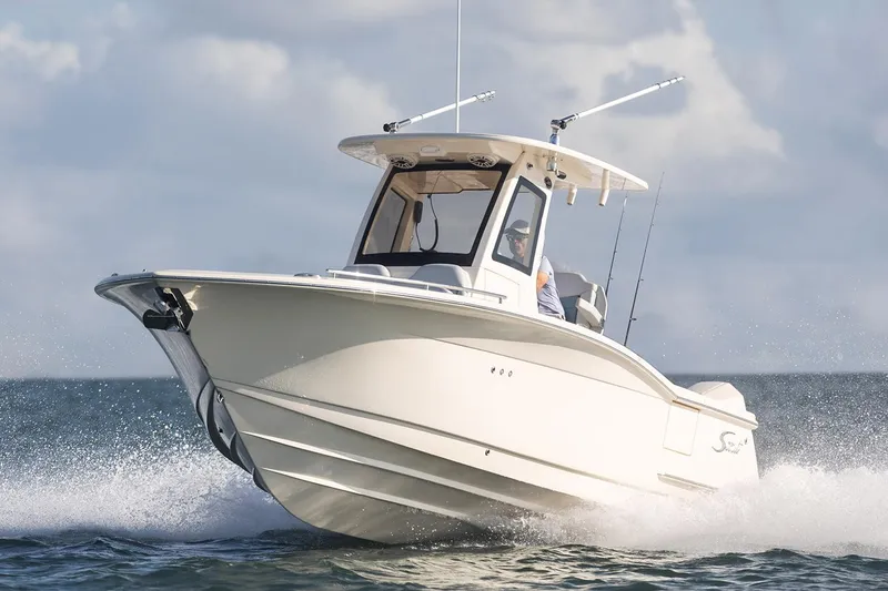 Slide: The Image of Manufacturer Provided Image: 2025 Scout 260 LXF boat cruising on open water. - 25