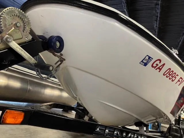 Slide: The Image of 2008 Sea-Doo 150 Speedster boat on trailer, close-up of hull and registration. - 13