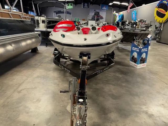 Slide: The Image of 2008 Sea-Doo 150 Speedster boat on trailer in showroom, front view. - 2