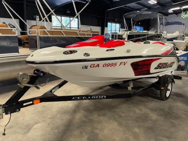 Slide: The Image of 2008 Sea-Doo 150 Speedster boat on trailer in indoor showroom. - 3