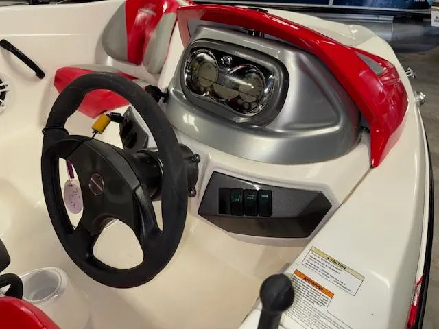 Slide: The Image of 2008 Sea-Doo 150 Speedster dashboard with steering wheel and controls, featuring red and white interior. - 7