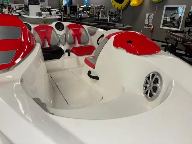 Slide: The Image of 2008 Sea-Doo 150 Speedster boat interior with red and white seating, showcasing sporty design. - 9