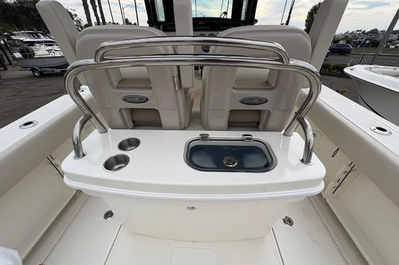 Slide: The Image of 2026 Boston Whaler 250 Outrage boat interior with seating and storage features. - 5