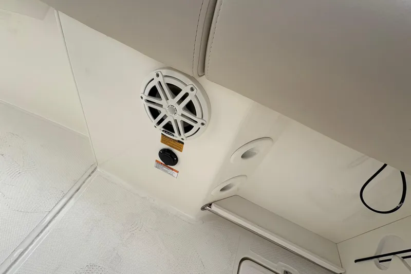 Slide: The Image of Interior view of 2026 Boston Whaler 250 Outrage featuring speaker and control panel. - 6